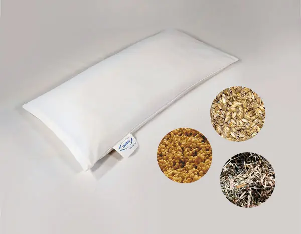 weißes Kopfkissen mit speltex-label mit drei kleinen kreisen rechts unten mit den dargestellten Füllstoffen